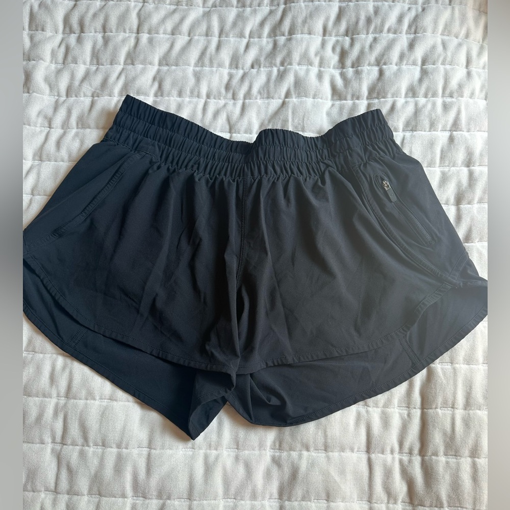 Black lululemon high rise track that short black size 10 3in